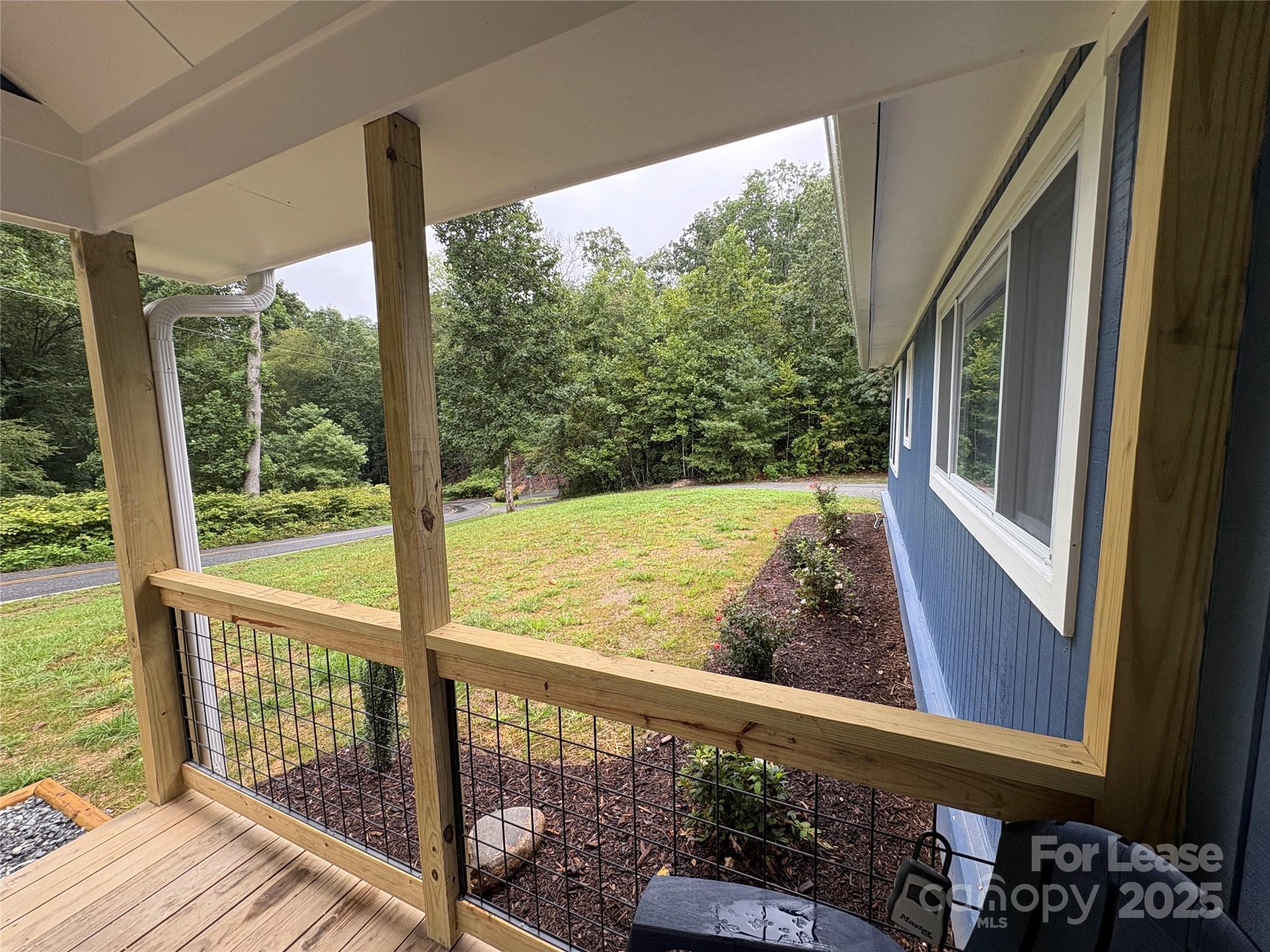 1175 Kilpatrick Road Hendersonville, NC 28739 - Photo 28 of 34 a view of a balcony with wooden floor