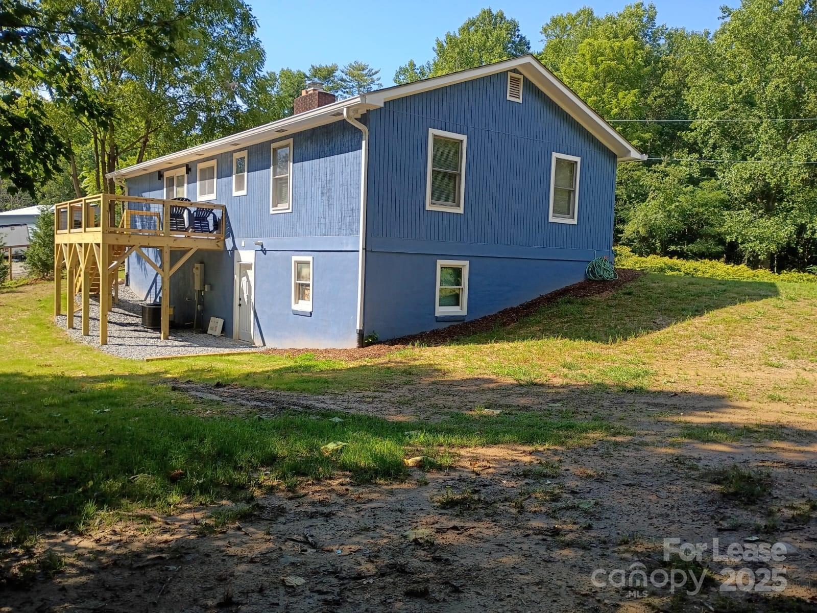 1175 Kilpatrick Road Hendersonville, NC 28739 - Photo 34 of 34 a view of a house with a backyard