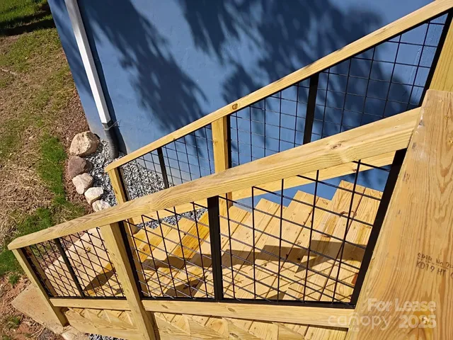a view of balcony with wooden stairs