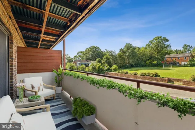 a view of balcony with furniture