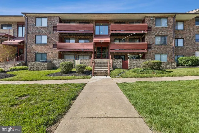 a front view of a building with garden