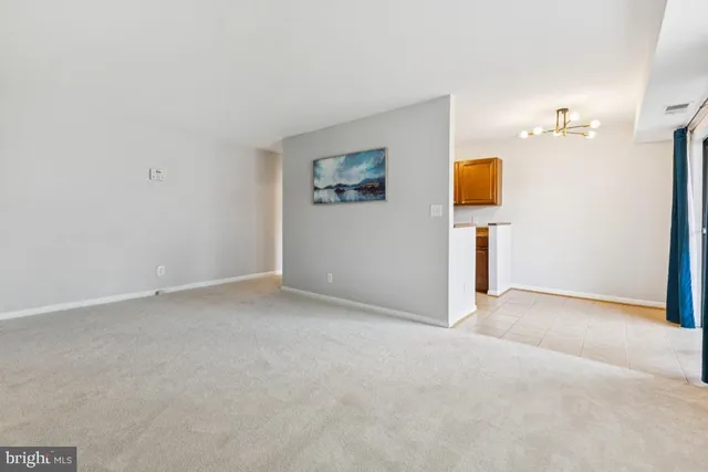 a kitchen with a sink a stove cabinets and a refrigerator