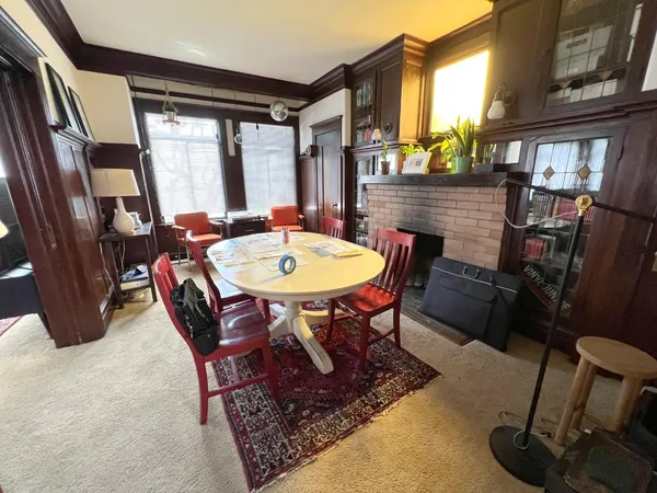 a room with furniture a rug and a window