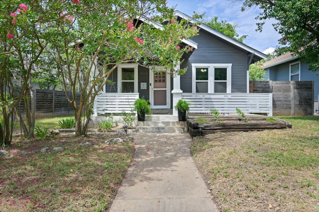 404 West 37th Street Austin, TX 78705 - Photo 1 of 1 a view of house with backyard and a chair