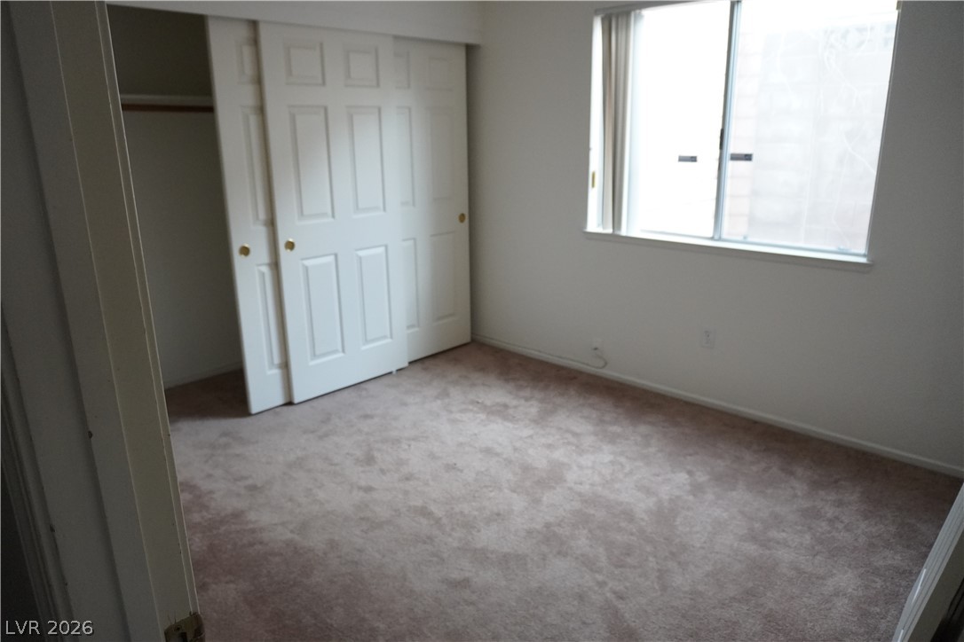 8328 Del Rey Avenue Las Vegas, NV 89117 - Photo 32 of 38 An inviting room, ready for your personal touch, featuring soft carpet and ample natural light.