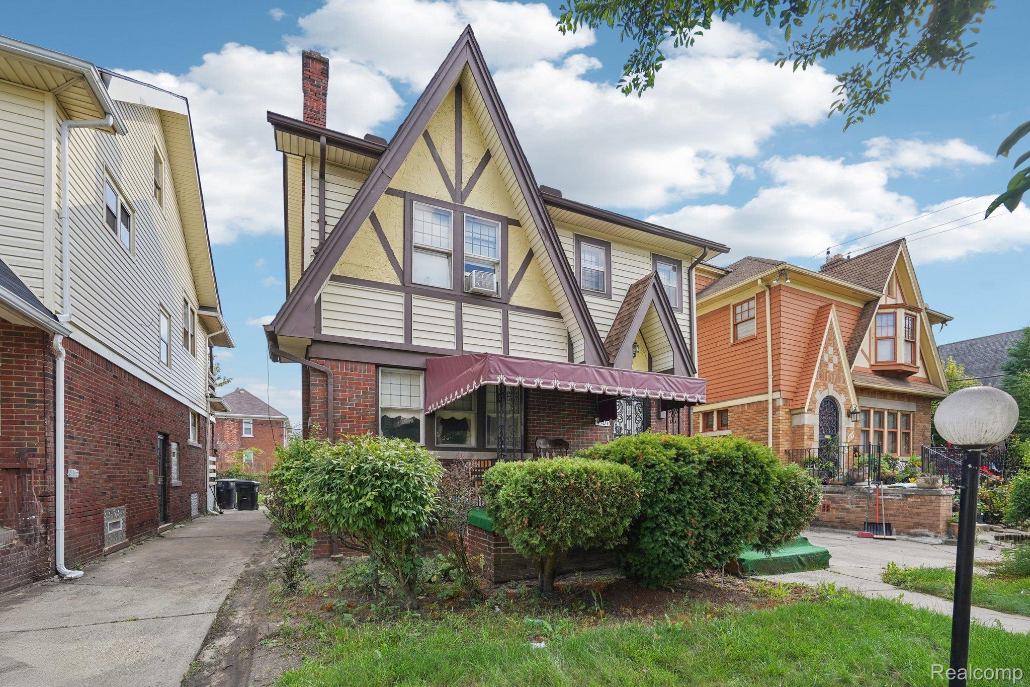 4101 Pasadena Street Detroit, MI 48238 - Photo 2 of 42 Brick and siding exterior with decorative half-timbering, prominent gables, and a pitched roof