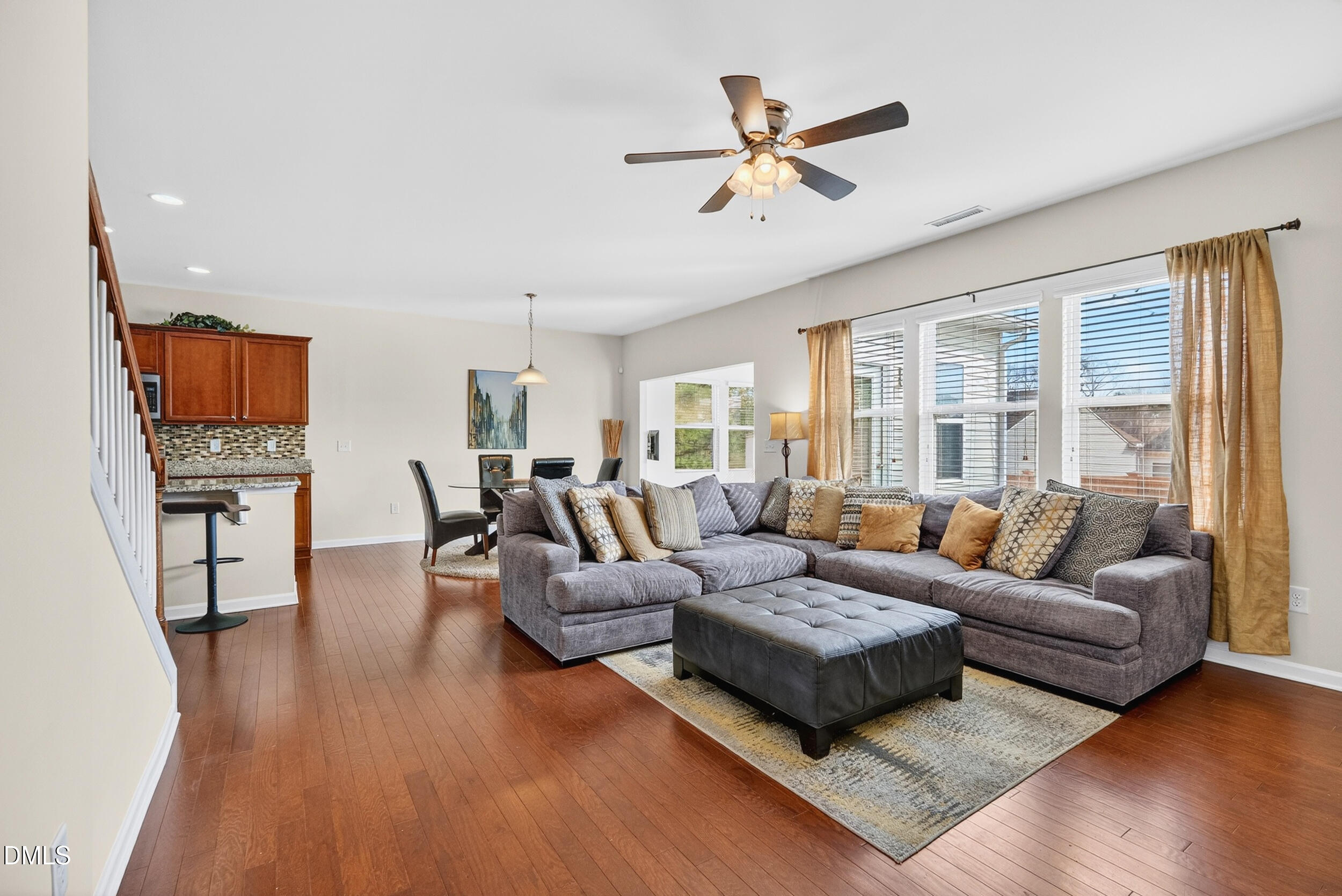 8144 Hovingham Way Raleigh, NC 27616 - Photo 10 of 37 a living room with furniture and a large window