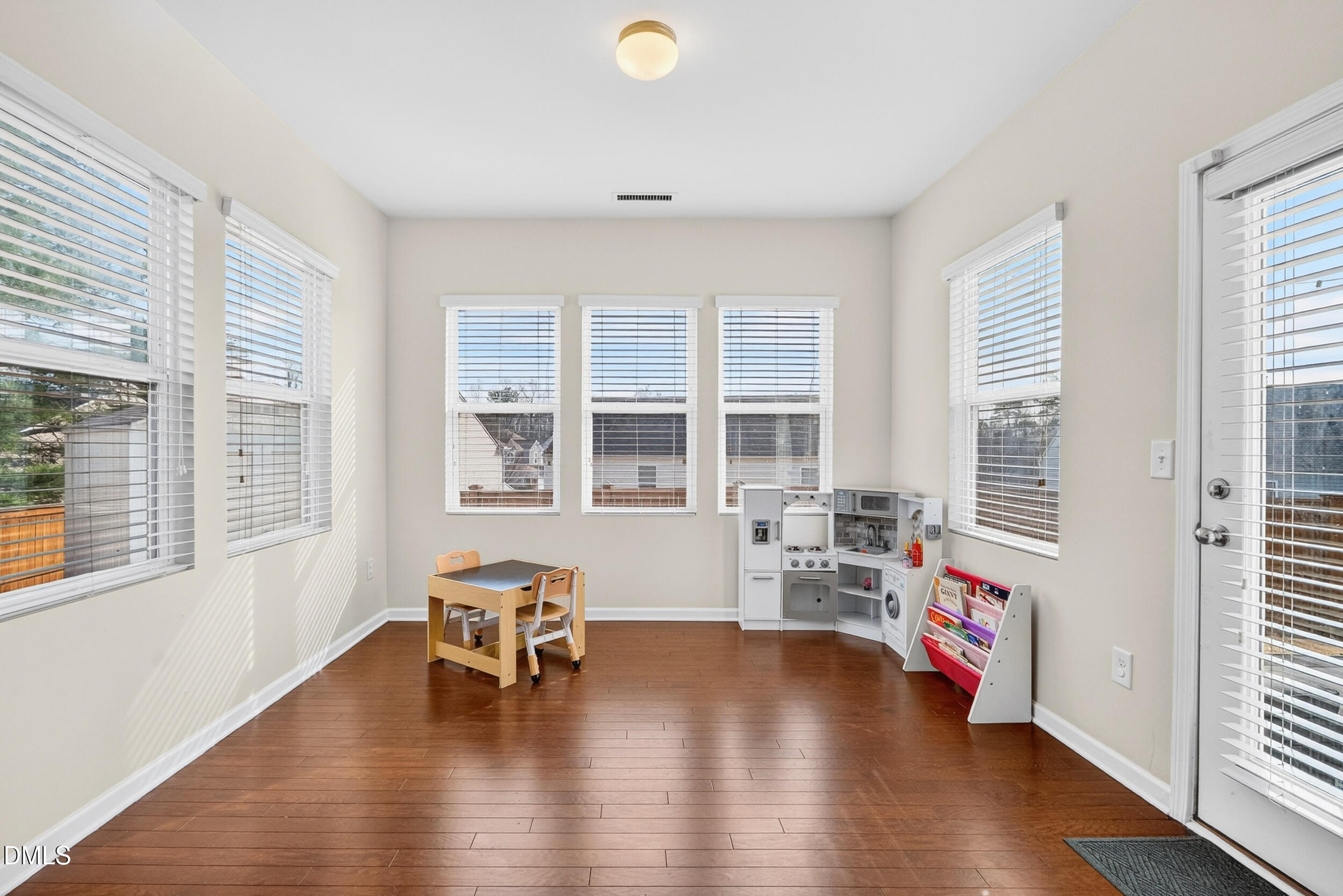 8144 Hovingham Way Raleigh, NC 27616 - Photo 11 of 37 a living room with furniture and a large window