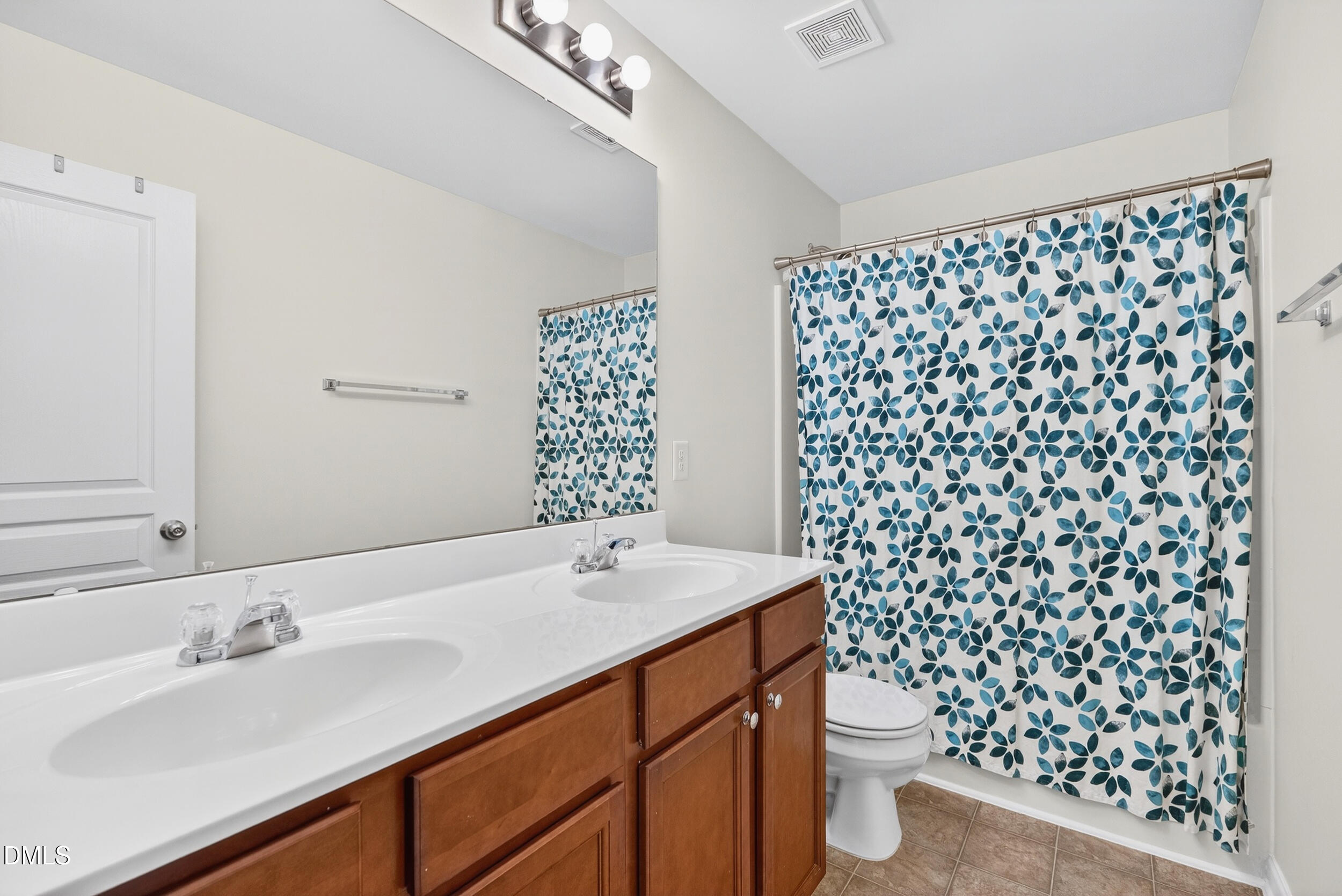 8144 Hovingham Way Raleigh, NC 27616 - Photo 19 of 37 a bathroom with a sink toilet and shower