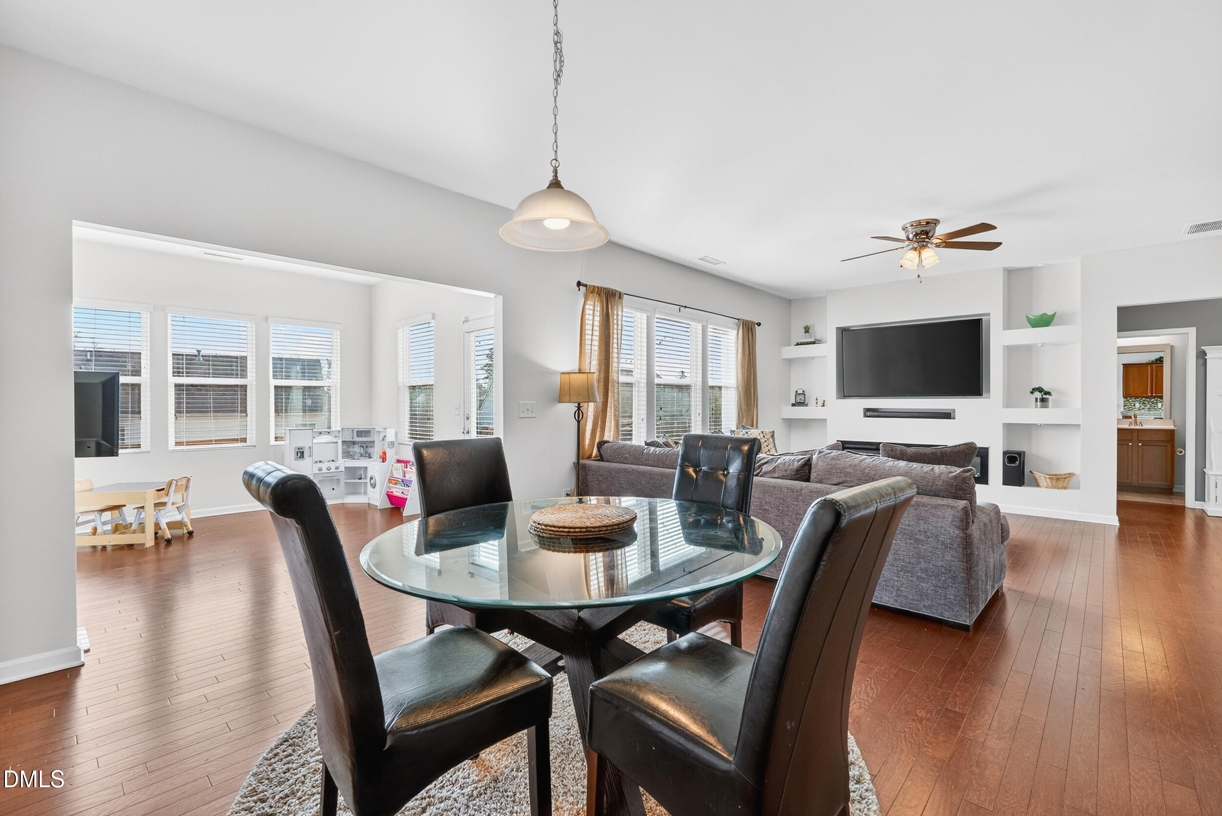 8144 Hovingham Way Raleigh, NC 27616 - Photo 8 of 37 a view of a dining room with furniture and wooden floor