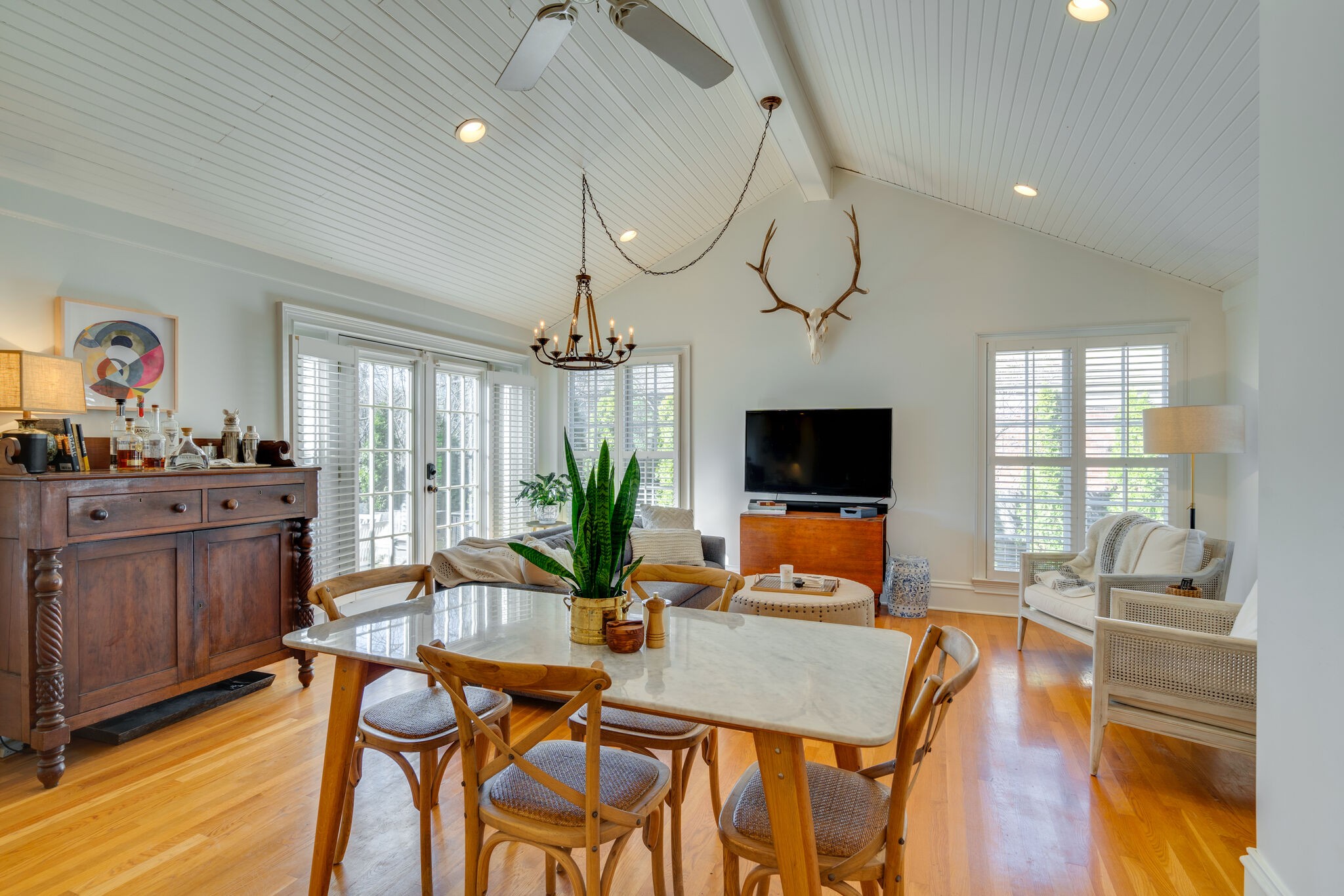 411 Page Road Nashville, TN 37205 - Photo 11 of 53 a dining room with furniture a chandelier and wooden floor