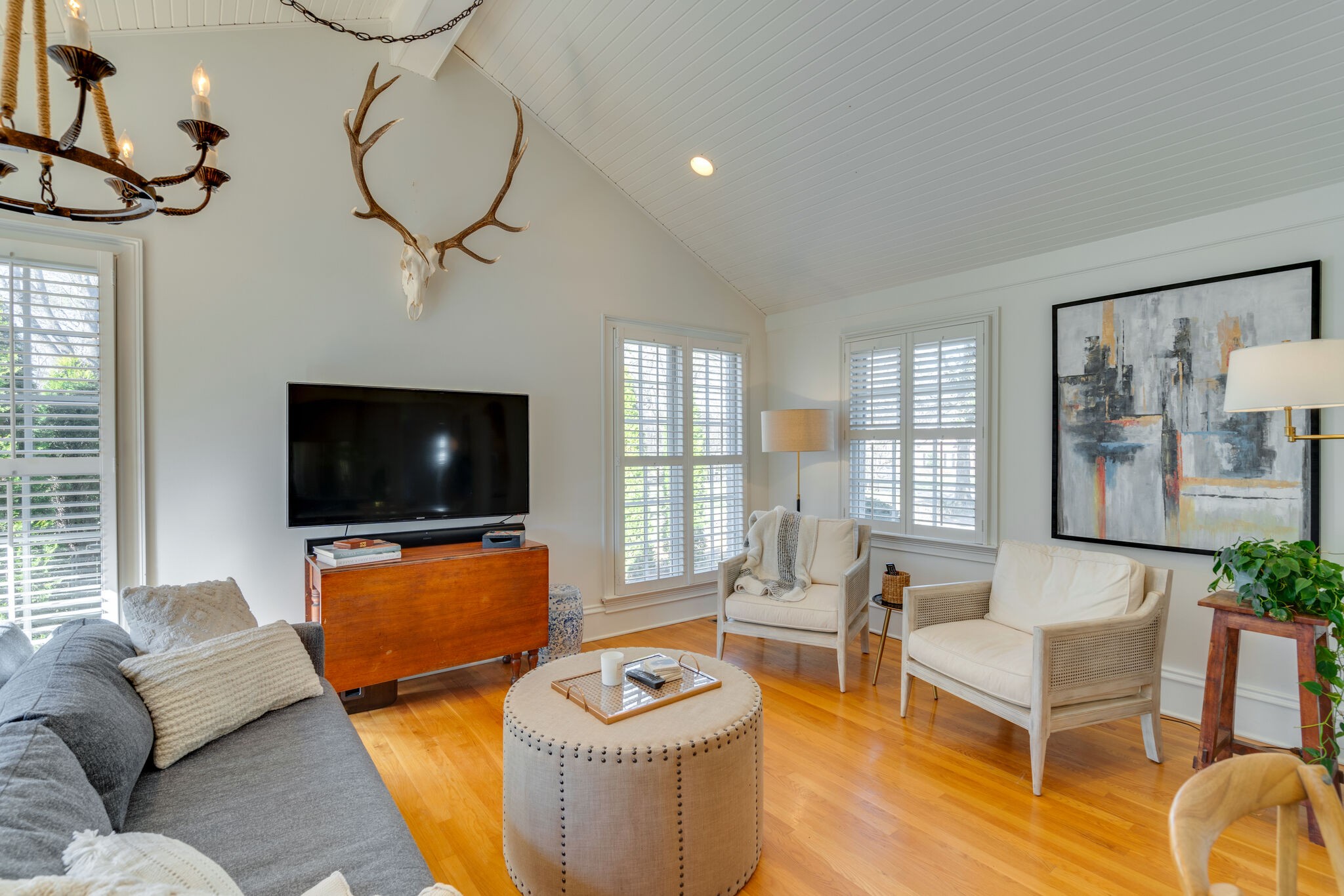 411 Page Road Nashville, TN 37205 - Photo 12 of 53 a living room with furniture a flat screen tv and a large window