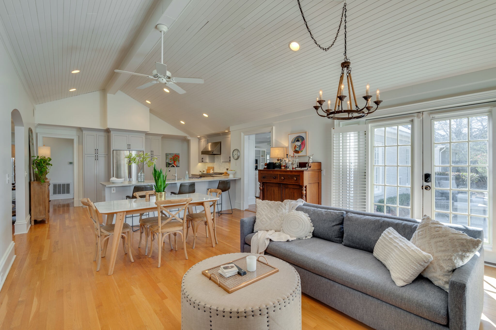 411 Page Road Nashville, TN 37205 - Photo 13 of 53 a living room with furniture a chandelier and a dining table