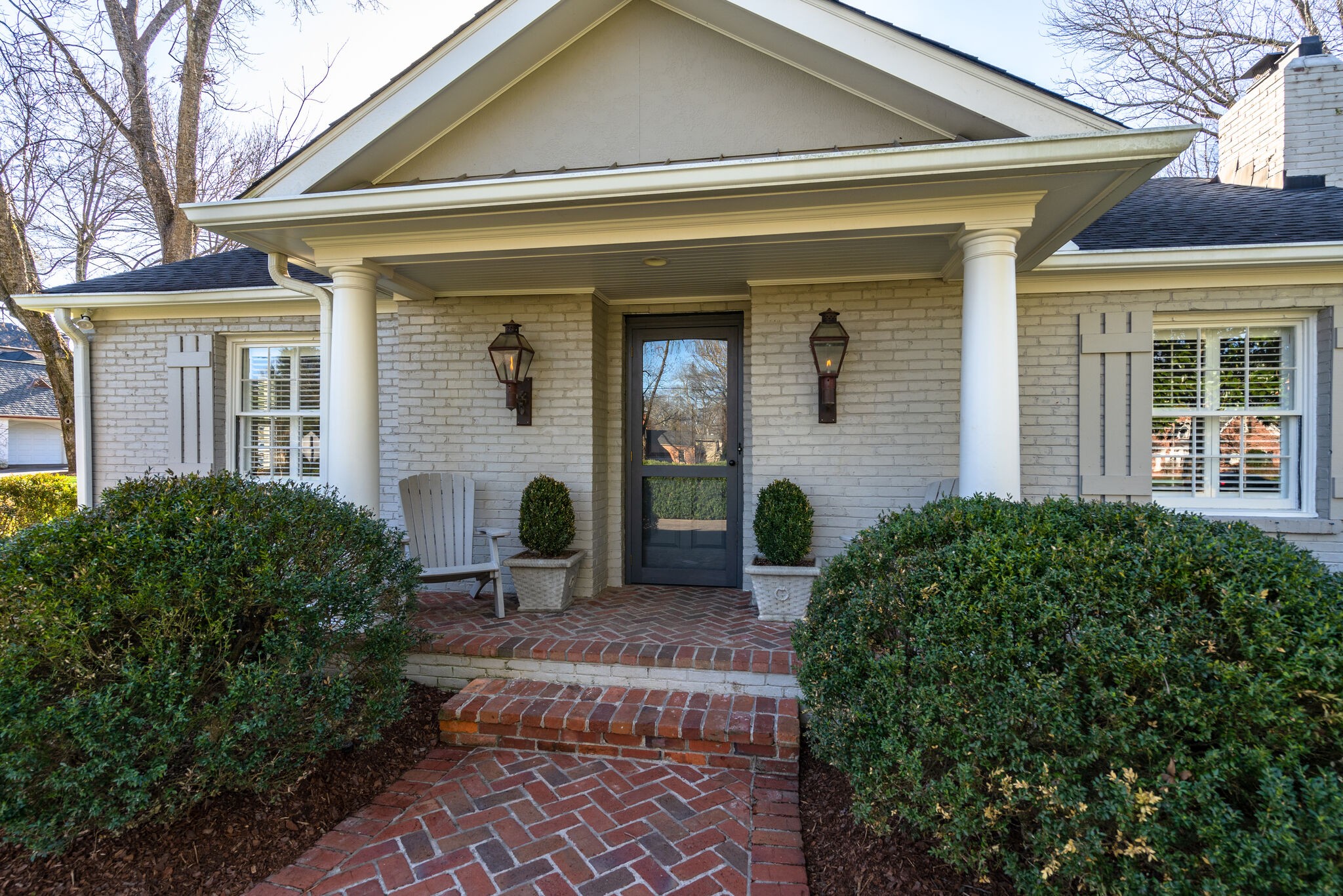 411 Page Road Nashville, TN 37205 - Photo 3 of 53 a front view of a house with garden