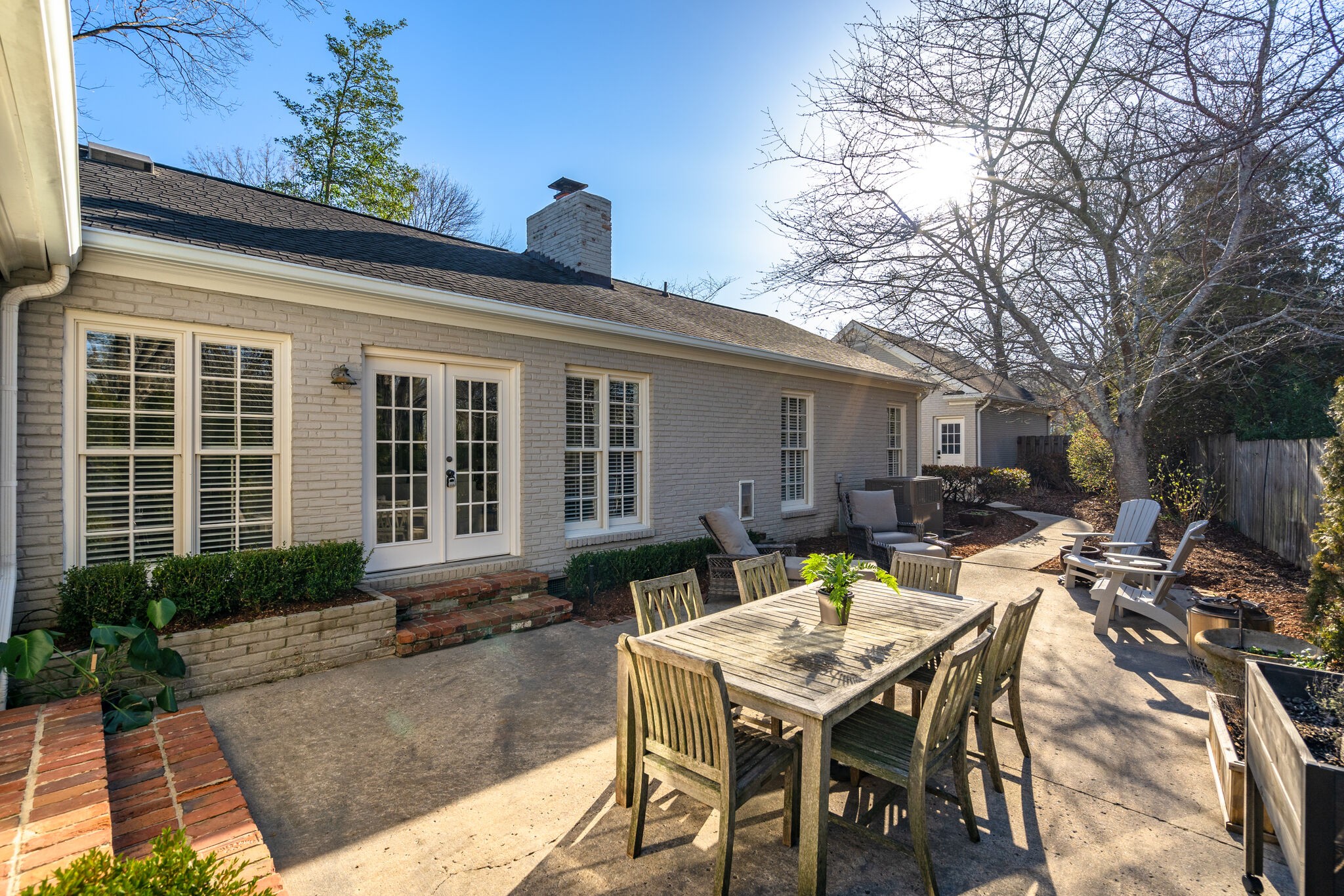 411 Page Road Nashville, TN 37205 - Photo 31 of 53 a view of a house with backyard sitting area and furniture