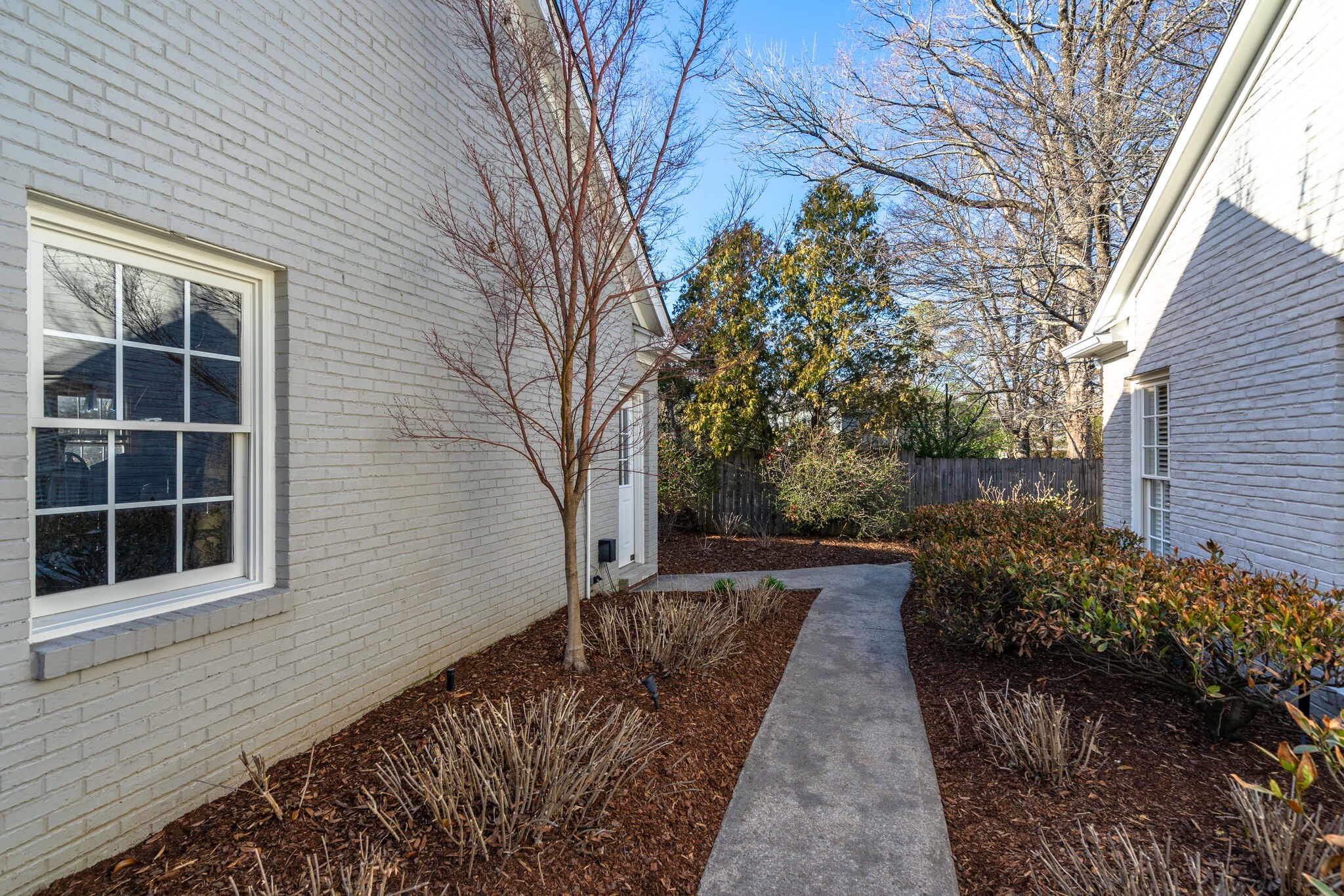 411 Page Road Nashville, TN 37205 - Photo 35 of 53 a pathway of a house with backyard and trees