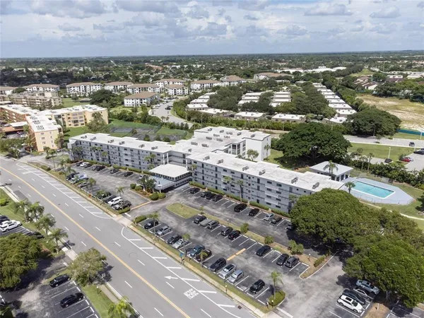 an aerial view of residential building and lake view