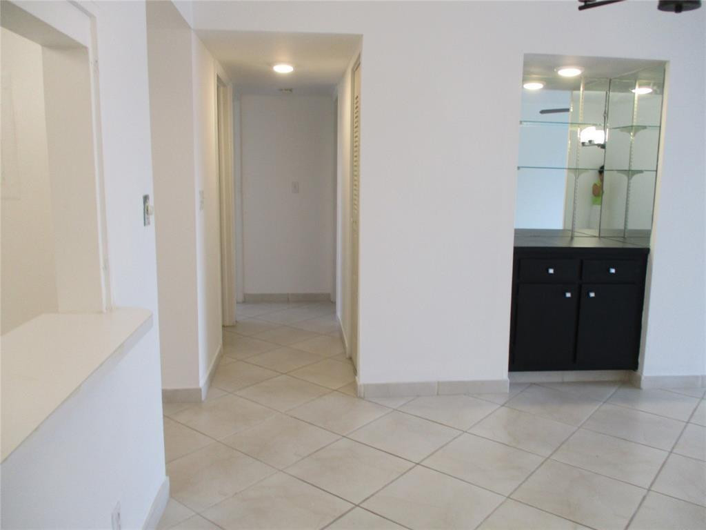 9233 Southwest 8th Street, Unit 311 Boca Raton, FL 33428 - Photo 17 of 19 a bathroom with a sink and mirror
