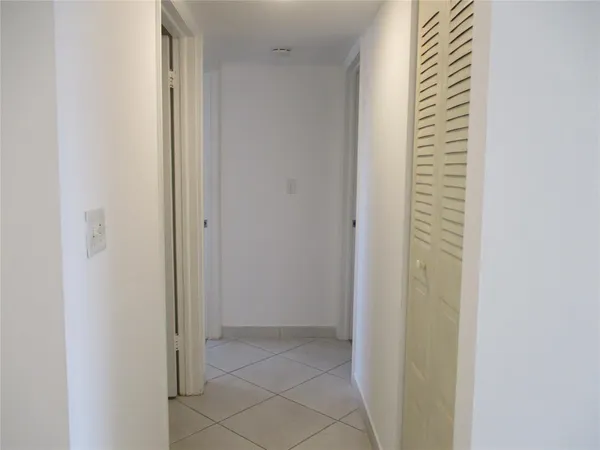 a view of a hallway with closet