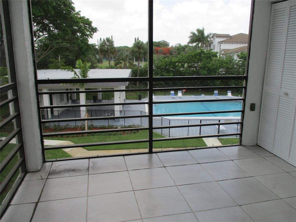 9233 Southwest 8th Street, Unit 311 Boca Raton, FL 33428 - Photo 19 of 19 a view of a couple of benches sitting in a balcony