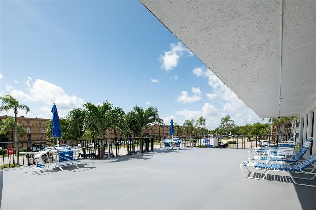 9233 Southwest 8th Street, Unit 311 Boca Raton, FL 33428 - Photo 2 of 19 a city view with a sitting space