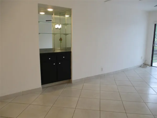 a bathroom with a sink vanity and mirror