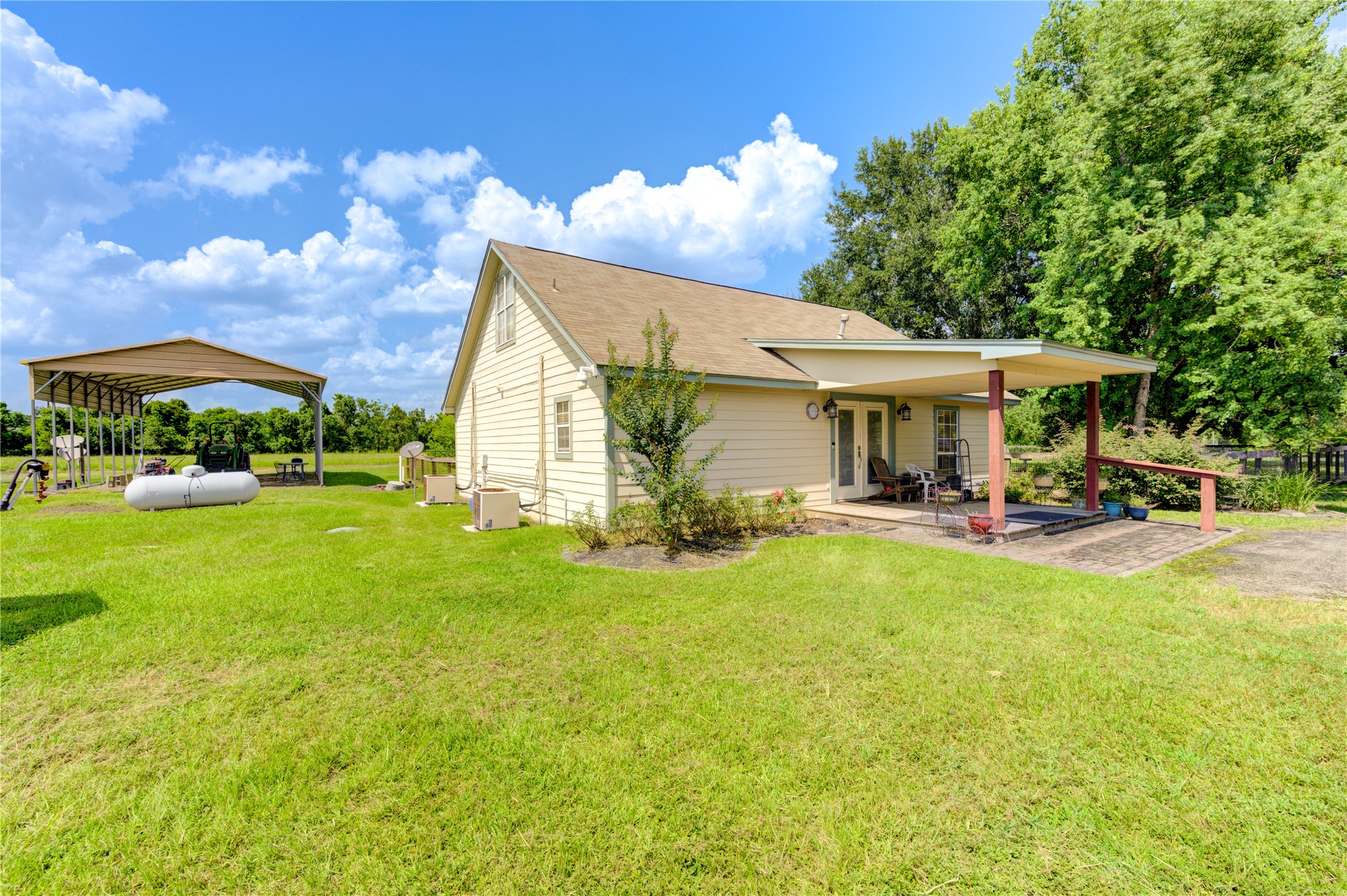 922 Agg Road Tomball, TX 77375 - Photo 6 of 23 a view of a house with a patio