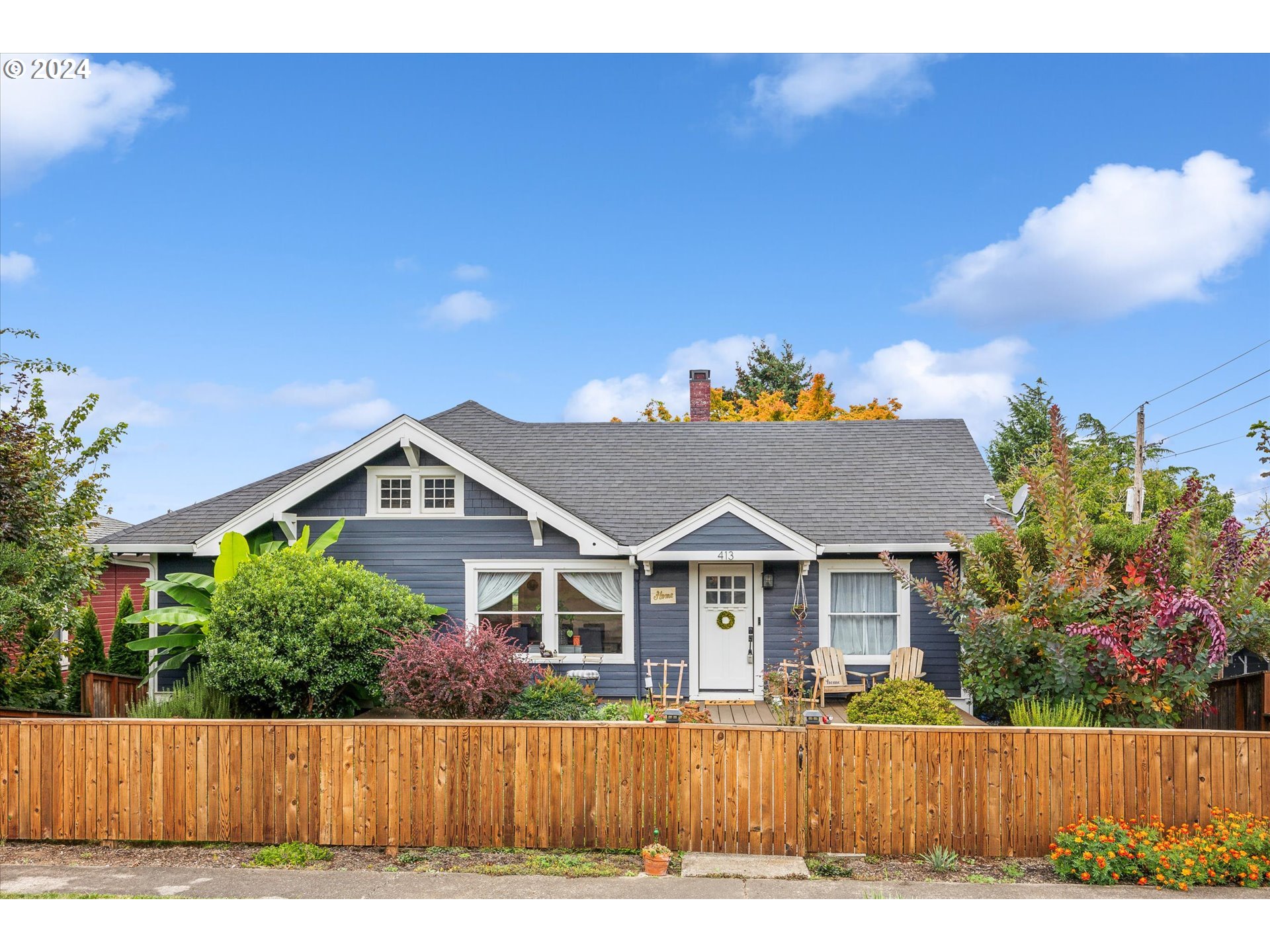 413 North 1st Avenue Ridgefield, WA 98642 - Photo 1 of 36 a view of a house with wooden fence