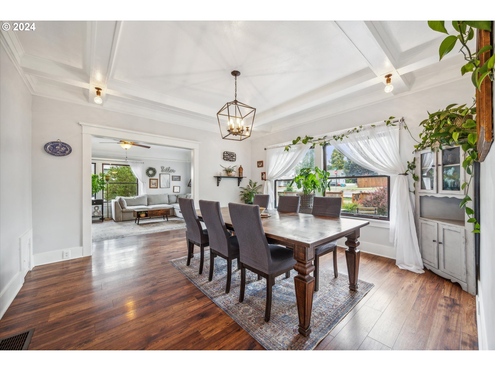 413 North 1st Avenue Ridgefield, WA 98642 - Photo 11 of 36 a view of a dining room with furniture and wooden floor