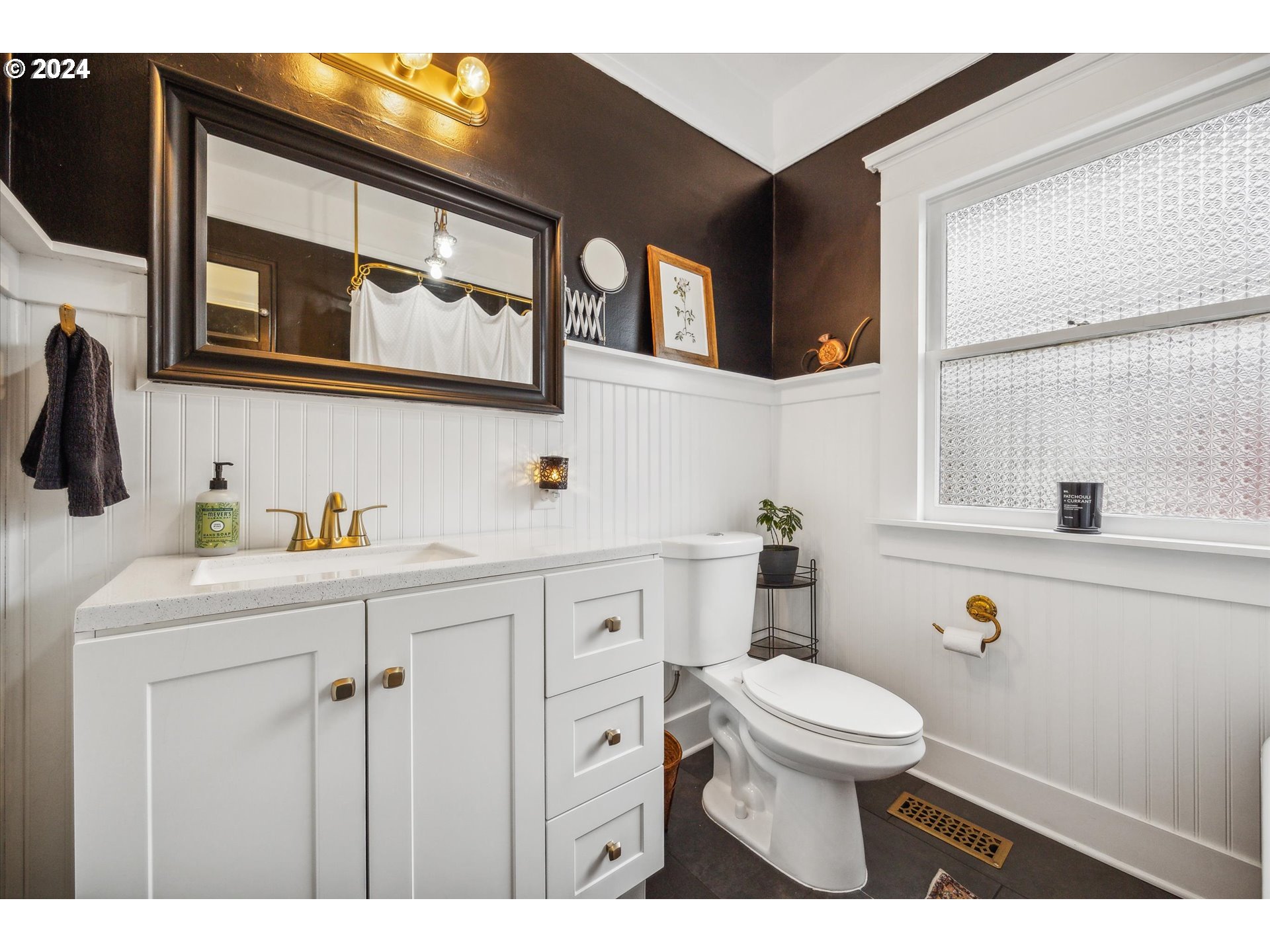 413 North 1st Avenue Ridgefield, WA 98642 - Photo 19 of 36 a bathroom with a sink a toilet and a mirror