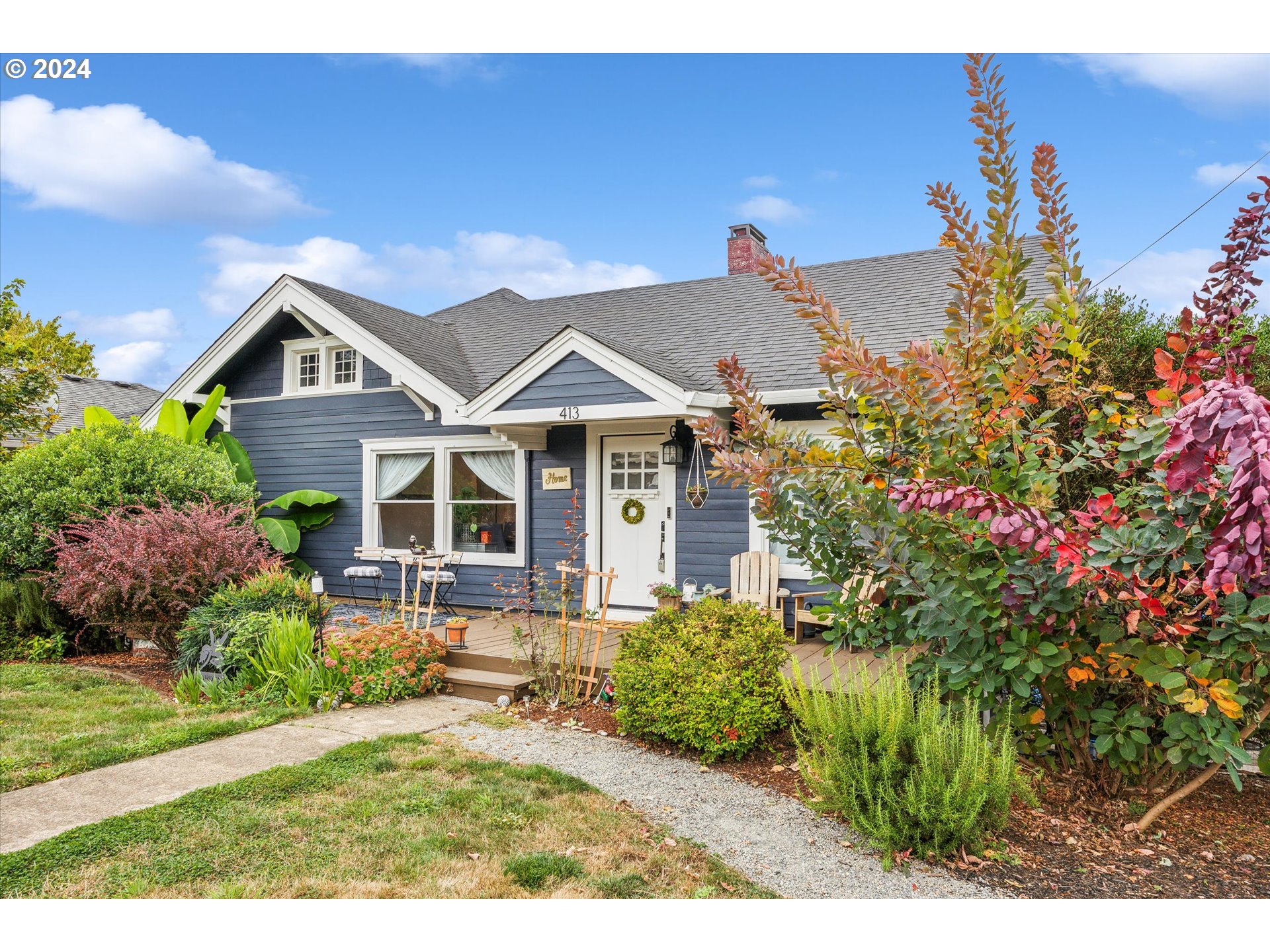 413 North 1st Avenue Ridgefield, WA 98642 - Photo 3 of 36 a front view of a house with a yard