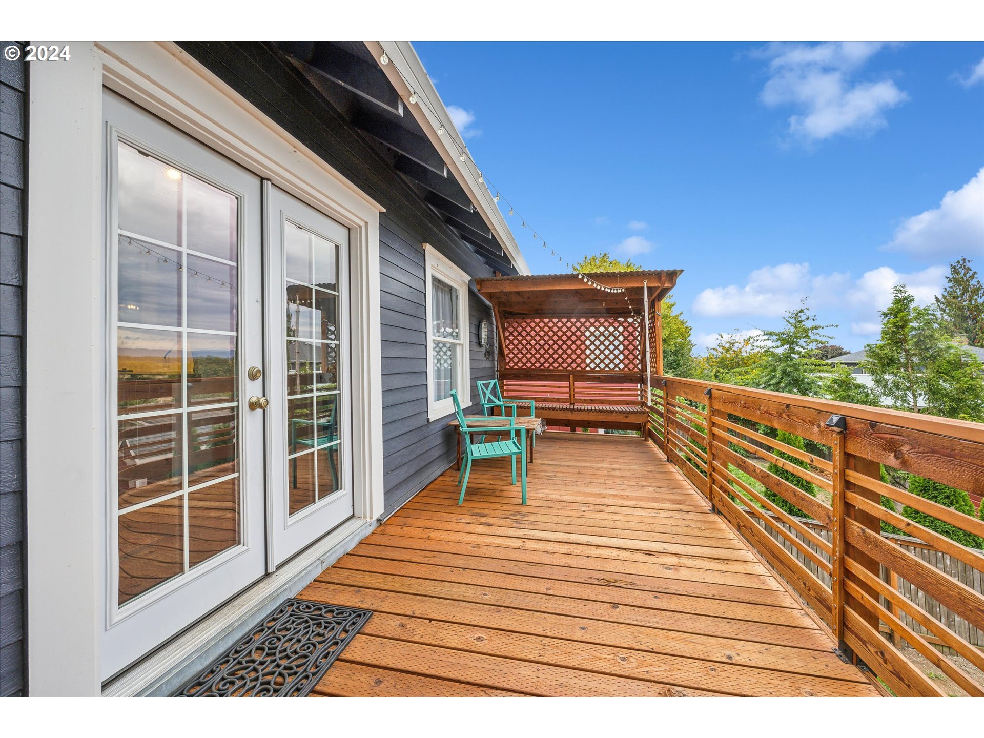 413 North 1st Avenue Ridgefield, WA 98642 - Photo 31 of 36 a view of a balcony with wooden floor and seating space