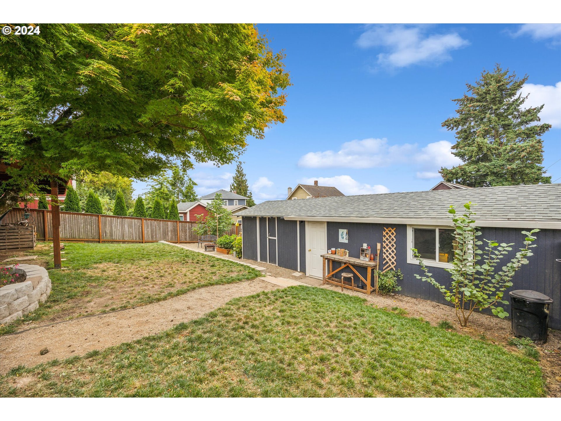 413 North 1st Avenue Ridgefield, WA 98642 - Photo 33 of 36 a view of a house with backyard and a garden