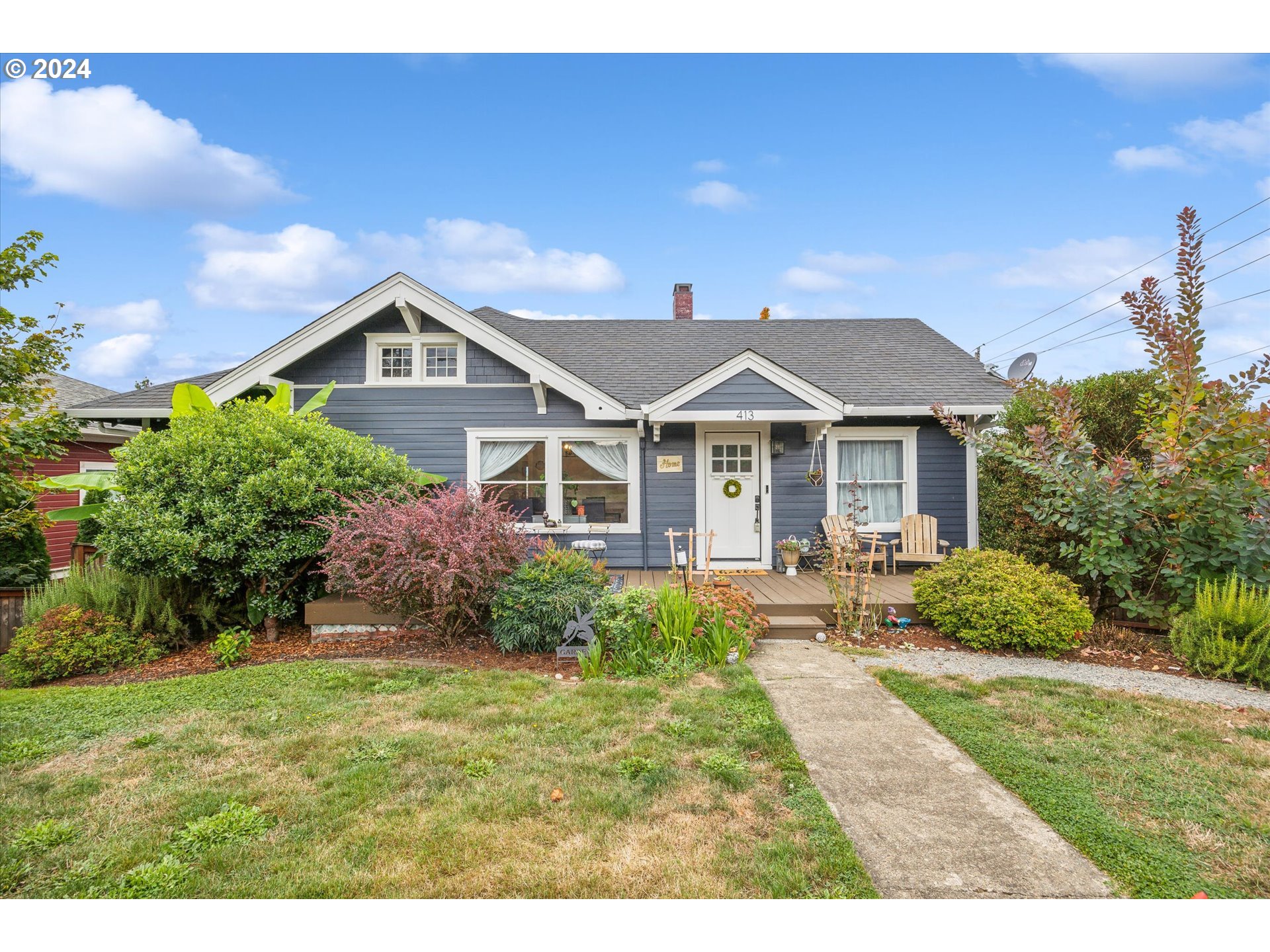 413 North 1st Avenue Ridgefield, WA 98642 - Photo 4 of 36 a front view of a house with a yard