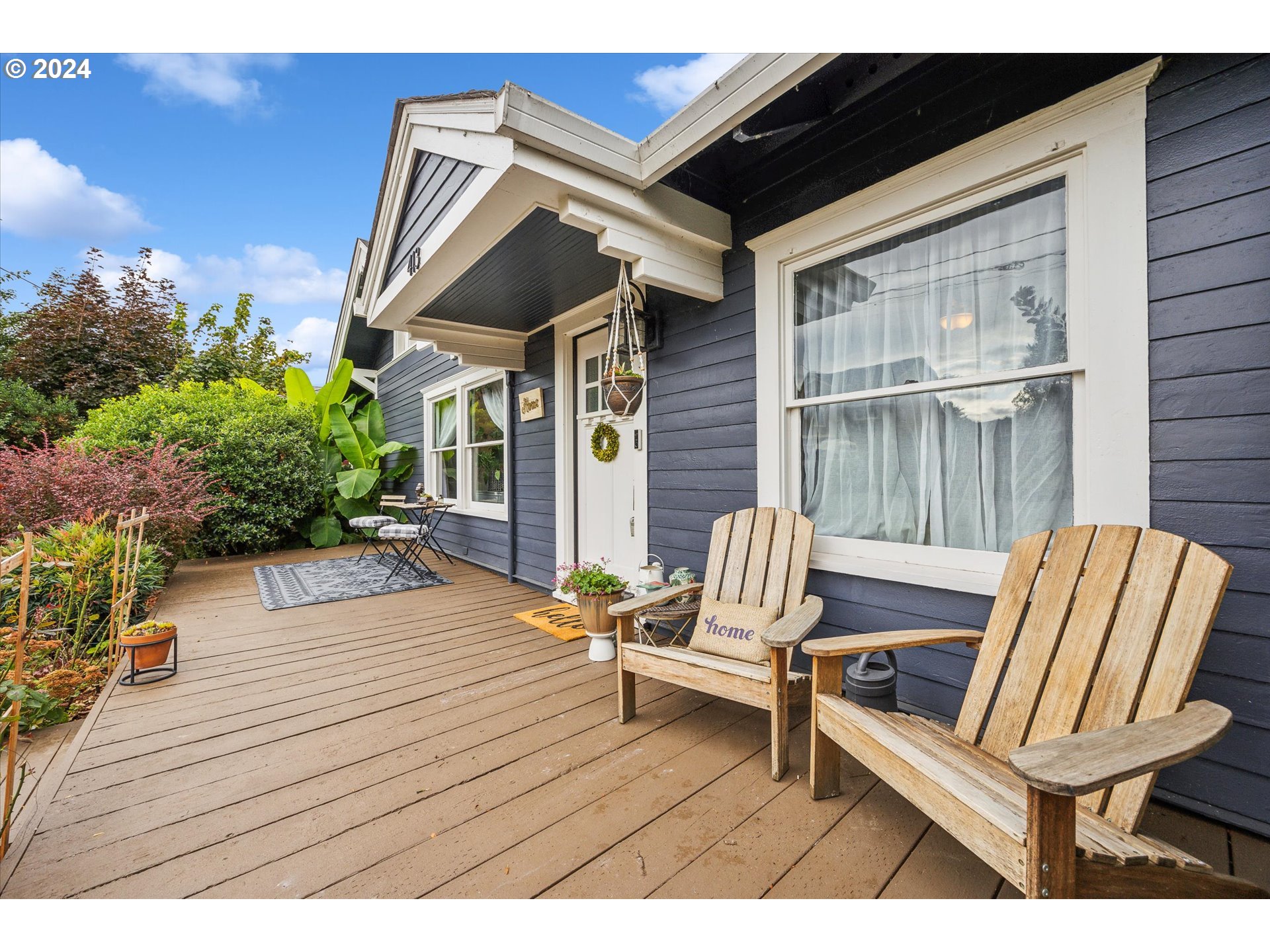 413 North 1st Avenue Ridgefield, WA 98642 - Photo 5 of 36 a balcony with chairs and wooden fence
