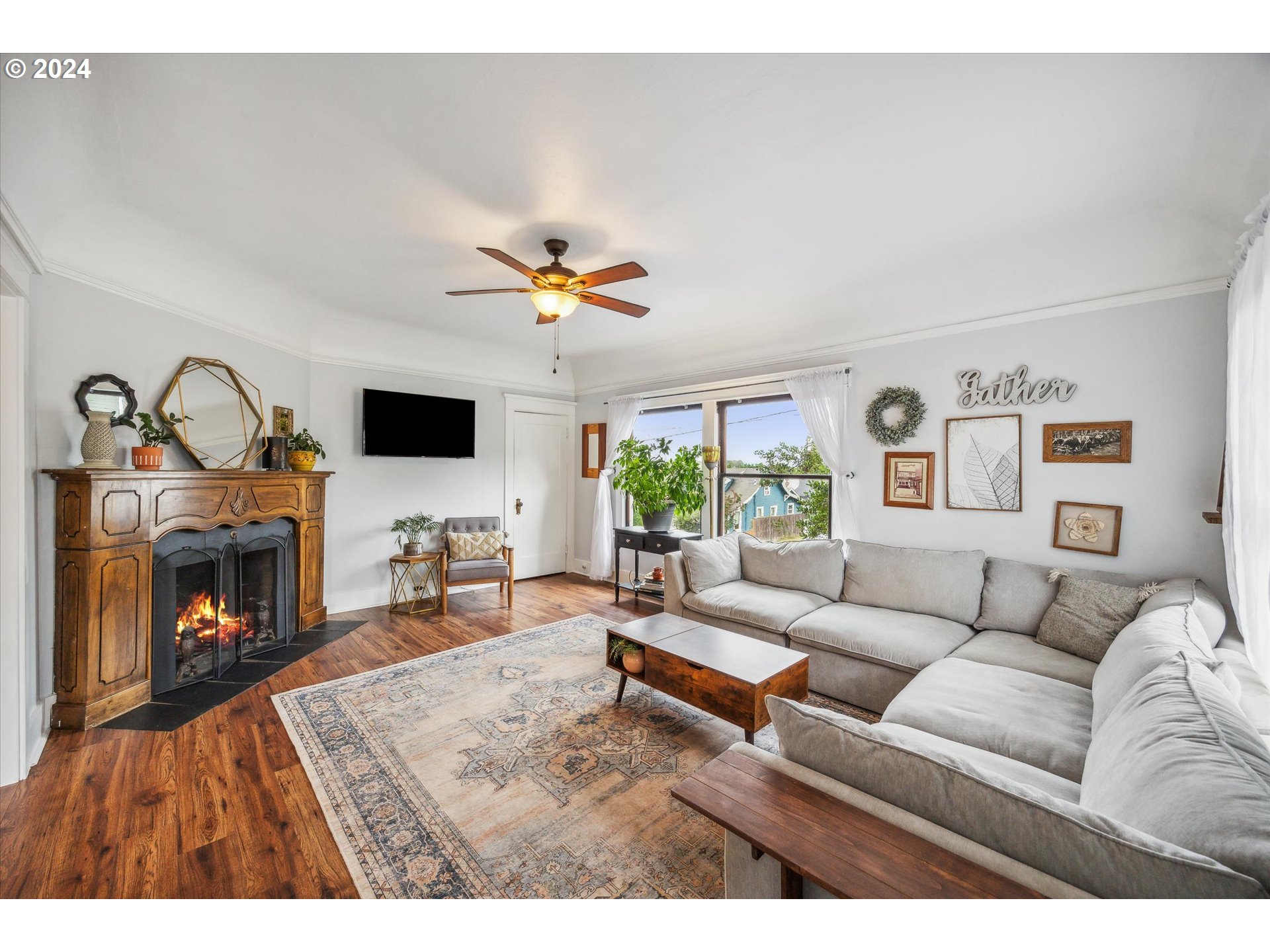 413 North 1st Avenue Ridgefield, WA 98642 - Photo 8 of 36 a living room with furniture and a fireplace