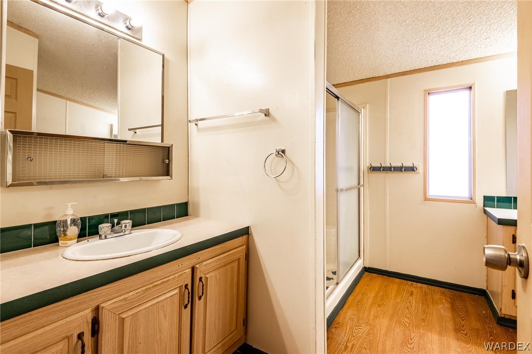 4496 Cowlic Road Golden Valley, AZ 86413 - Photo 16 of 50 a bathroom with a sink and a mirror