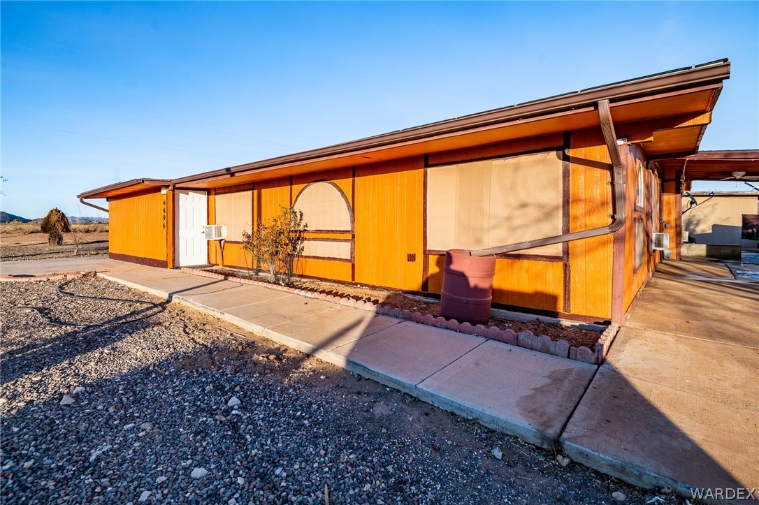 4496 Cowlic Road Golden Valley, AZ 86413 - Photo 29 of 50 a backyard of a house with yard and outdoor seating