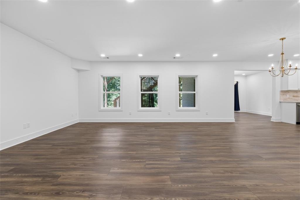 3528 North Bogan Road Buford, GA 30519 - Photo 54 of 79 a view of an empty room with wooden floor and a window