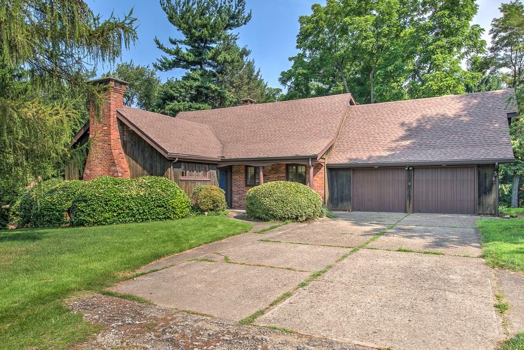 709 Camp Meeting Road Sewickley, PA 15143 - Photo 1 of 18 a view of a house with a yard plants and large tree