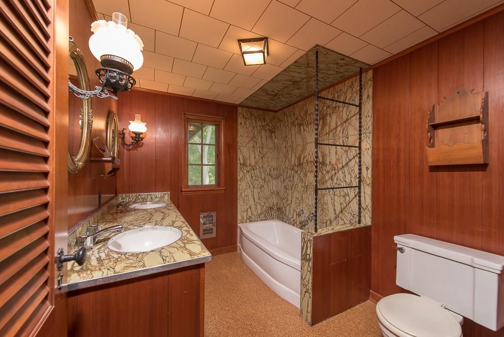 709 Camp Meeting Road Sewickley, PA 15143 - Photo 13 of 18 a bathroom with a granite countertop sink a toilet and shower