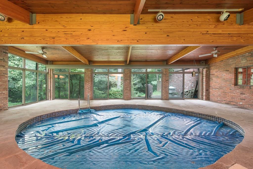 709 Camp Meeting Road Sewickley, PA 15143 - Photo 14 of 18 a view of a living room and floor to ceiling window