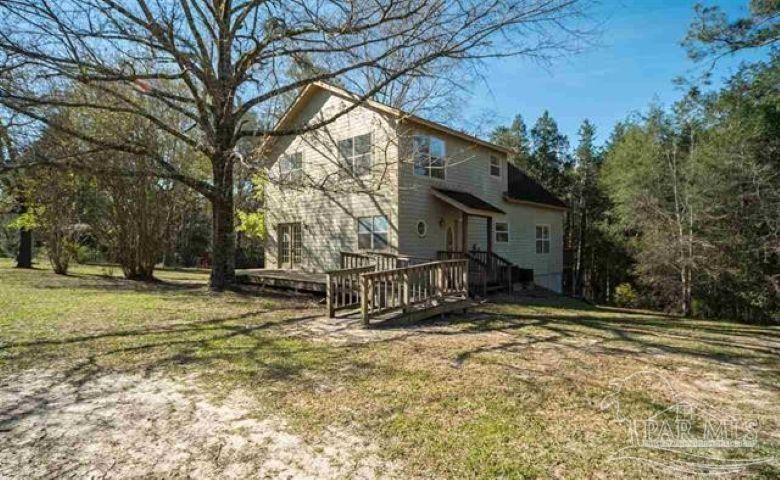 a view of house with a outdoor space