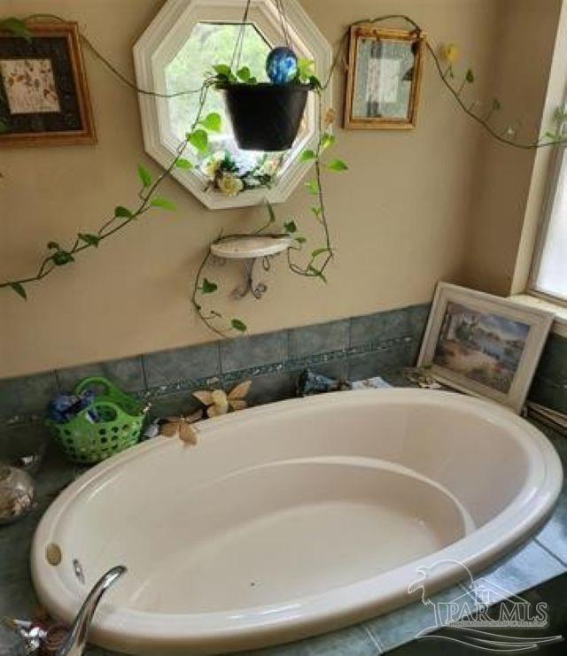 9543 Quiet Creek Road Milton, FL 32570 - Photo 14 of 16 a bathroom with a sink and mirror