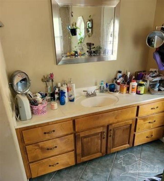 9543 Quiet Creek Road Milton, FL 32570 - Photo 15 of 16 a bathroom with a sink and a mirror