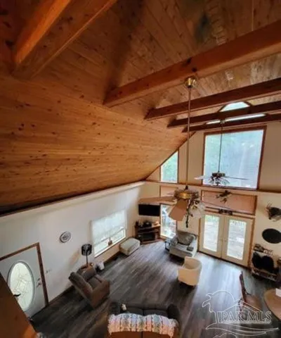 a view of a couch with wooden floor