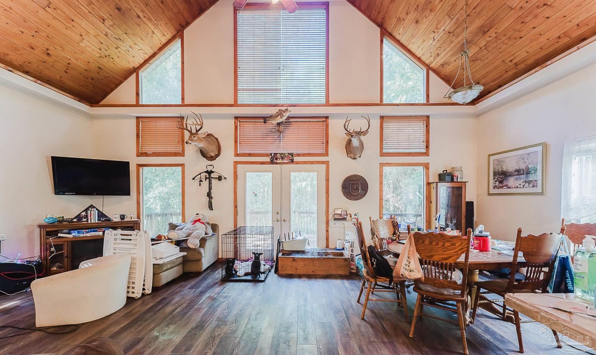9543 Quiet Creek Road Milton, FL 32570 - Photo 6 of 16 a living room with furniture and a flat screen tv