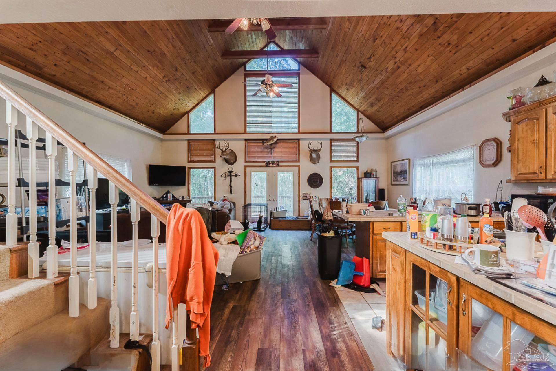 9543 Quiet Creek Road Milton, FL 32570 - Photo 7 of 16 a view of a living room and utility room