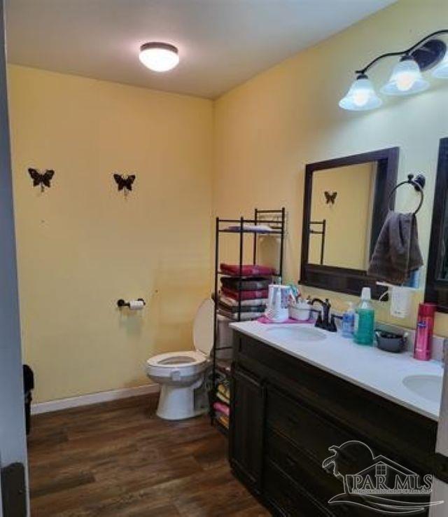 9543 Quiet Creek Road Milton, FL 32570 - Photo 10 of 16 a bathroom with a sink vanity granite and toilet