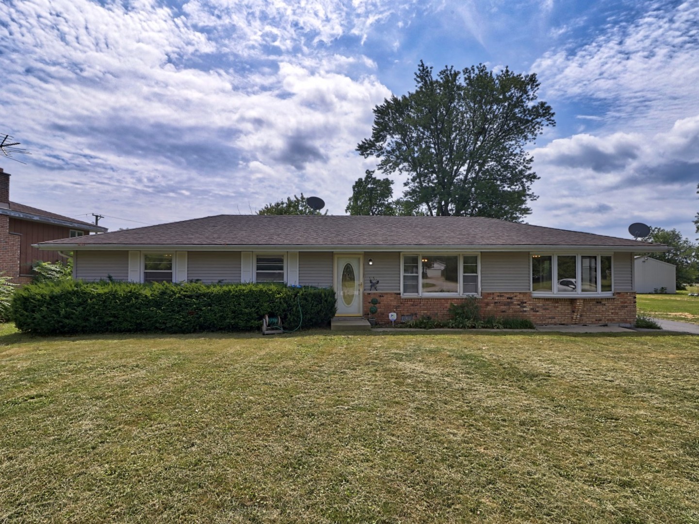 5159 West Margaret Street Monee, IL 60449 - Photo 1 of 13 a front view of a house with a garden and trees